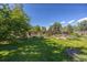 Well maintained backyard with lush lawn, garden beds and a wood fence at 1424 Cypress Cir, Lafayette, CO 80026