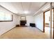 Finished basement area with a fireplace, adjacent to another room at 1424 Cypress Cir, Lafayette, CO 80026