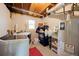 Basement laundry area with washer, dryer, and water heater at 1424 Cypress Cir, Lafayette, CO 80026