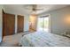 Bright bedroom featuring a ceiling fan, neutral carpet and a sliding door to the balcony at 1424 Cypress Cir, Lafayette, CO 80026