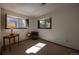 Well-lit bedroom with a vintage accent chair, a sunny window, and neutral decor at 1424 Cypress Cir, Lafayette, CO 80026