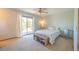 Serene bedroom with large windows providing natural light and access to a private balcony at 1424 Cypress Cir, Lafayette, CO 80026