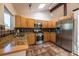 Well-equipped kitchen with stainless steel appliances, granite countertops, and ample cabinet space at 1424 Cypress Cir, Lafayette, CO 80026