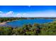 Beautiful aerial view of the lake framed by green trees on a sunny day at 1424 Cypress Cir, Lafayette, CO 80026