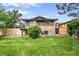 Spacious backyard with lush green grass and a private balcony area at 2067 Depew St, Edgewater, CO 80214