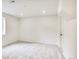 A bright, open basement room with neutral carpet, recessed lighting, and white walls creates a fresh, adaptable space at 2067 Depew St, Edgewater, CO 80214