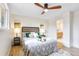 Tastefully decorated bedroom with wood floors adjacent to en-suite bathroom at 2067 Depew St, Edgewater, CO 80214