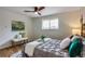 Inviting bedroom with light walls, soft rug, and a decorative bench at the end of the bed at 2067 Depew St, Edgewater, CO 80214
