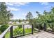 Scenic deck view overlooking trees and neighborhood landscape, creating a serene and inviting atmosphere at 2067 Depew St, Edgewater, CO 80214