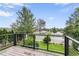 Expansive deck view featuring lush greenery and neighborhood scenery, providing a tranquil outdoor experience at 2067 Depew St, Edgewater, CO 80214