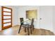 Cozy dining area with glass table, seating for two, and modern art at 2067 Depew St, Edgewater, CO 80214