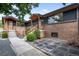Modern home featuring a brick facade, well-maintained landscaping, and inviting entrances at 2067 Depew St, Edgewater, CO 80214