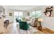Bright living room featuring modern decor, large windows, and hardwood floors at 2067 Depew St, Edgewater, CO 80214