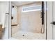 Beautiful shower with geometric tile, seating, and upscale hardware at 2067 Depew St, Edgewater, CO 80214