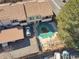 Aerial view of the townhome with pool, deck, and parking; showcasing amenities and layout at 1827 Quail St # 8, Lakewood, CO 80215