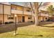 Traditional brick townhome with a well-maintained lawn, offering a comfortable and inviting living space at 1827 Quail St # 8, Lakewood, CO 80215