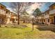 Charming townhomes feature a communal green space, creating a welcoming atmosphere at 1827 Quail St # 8, Lakewood, CO 80215