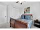 Cozy bedroom featuring a wood sleigh bed, neutral walls, and soft gray carpet at 16805 Greenfield Dr, Monument, CO 80132