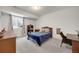 Cozy bedroom with gray carpet, a dresser and a window letting in plenty of light at 16805 Greenfield Dr, Monument, CO 80132