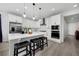 Modern kitchen featuring white cabinets, stainless steel appliances, and a large island at 16805 Greenfield Dr, Monument, CO 80132