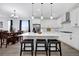 Modern kitchen featuring white cabinets, stainless steel appliances, and a large island at 16805 Greenfield Dr, Monument, CO 80132