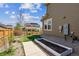 Well-kept backyard featuring a garden bed and side view of the home, providing a pleasant outdoor space for gardening and enjoyment at 13440 Monaco St, Thornton, CO 80602