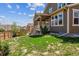 Exterior view of a well-maintained home, complete with a lush backyard and inviting covered patio, perfect for relaxation at 13440 Monaco St, Thornton, CO 80602