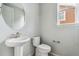 Powder room includes a pedestal sink and fixtures at 13440 Monaco St, Thornton, CO 80602