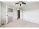 Spacious bedroom featuring neutral carpet and multiple doors for convenience at 13440 Monaco St, Thornton, CO 80602