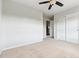 Bright, carpeted bedroom with a ceiling fan and closet, offering a comfortable and functional living space at 13440 Monaco St, Thornton, CO 80602
