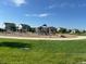 Community playground with modern equipment and ample space for children to play at 13440 Monaco St, Thornton, CO 80602