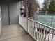 Balcony overlooking the community tennis court and grounds at 910 S Walden St # 101, Aurora, CO 80017
