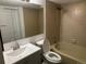 Well-lit bathroom with a tub, shower, sink, and large mirror at 910 S Walden St # 101, Aurora, CO 80017