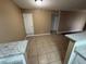 Bright dining space that blends into a kitchen and living area, offering versatile living at 910 S Walden St # 101, Aurora, CO 80017