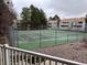 View of the community tennis court and nearby condos at 910 S Walden St # 101, Aurora, CO 80017