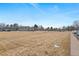 Sprawling community lawn offers green space, mature trees, and nearby housing units at 1289 S Wheeling Way, Aurora, CO 80012