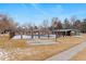 Fenced community pool and basketball area with mature trees offering a recreational space at 1289 S Wheeling Way, Aurora, CO 80012