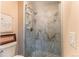 Modern glass shower with marble-like wall tiles at 5877 S Fulton Way, Greenwood Village, CO 80111