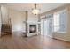 This living room features a fireplace, sliding glass door, and staircase at 7353 Norfolk Pl, Castle Pines, CO 80108