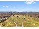 An aerial shot of a Denver golf course with the city skyline in the background at 2814 N Harrison St, Denver, CO 80205