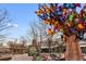 Outdoor view of the Denver Zoo with an artistic butterfly tree and visible signage at 2814 N Harrison St, Denver, CO 80205