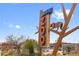 Denver Zoo sign with animal decoration and surrounding landscaping against a blue sky at 2814 N Harrison St, Denver, CO 80205