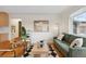 Bright living room featuring hardwood floors, modern furnishings, and a decorative rug at 2814 N Harrison St, Denver, CO 80205