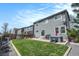 Spacious backyard with green lawn, patio, hot tub, and privacy fence at 16328 E Phillips Ln, Englewood, CO 80112