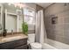 Updated bathroom with a shower, toilet, and vanity with a granite countertop at 16328 E Phillips Ln, Englewood, CO 80112