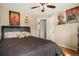 Bedroom with a comfortable bed and posters on the walls at 16328 E Phillips Ln, Englewood, CO 80112