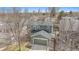 Exterior view of a two-story home with a garage and well-maintained lawn at 16328 E Phillips Ln, Englewood, CO 80112