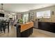Bright and airy living area flowing from a full kitchen, dining area, and fireplace at 16328 E Phillips Ln, Englewood, CO 80112