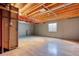 Unfinished basement with exposed beams, providing ample space for customization and storage at 4302 Nepal St, Denver, CO 80249