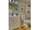 Charming bathroom with a modern vanity, framed mirror, and marble-style shower creates a soothing and luxurious experience at 4302 Nepal St, Denver, CO 80249